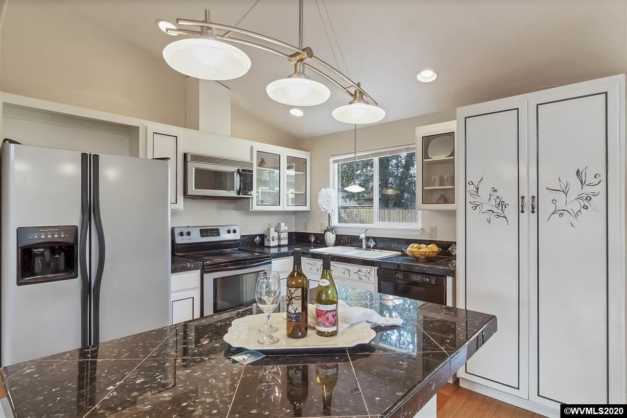 Open kitchen with granite counters.